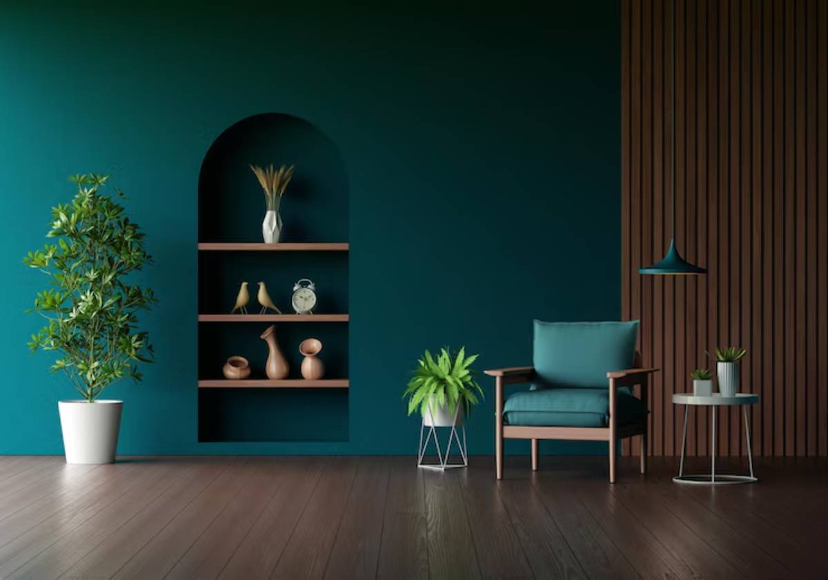 Modern living room with a teal wall, wooden accents, potted plants, a comfy chair, and a minimalist shelf displaying decorative items.